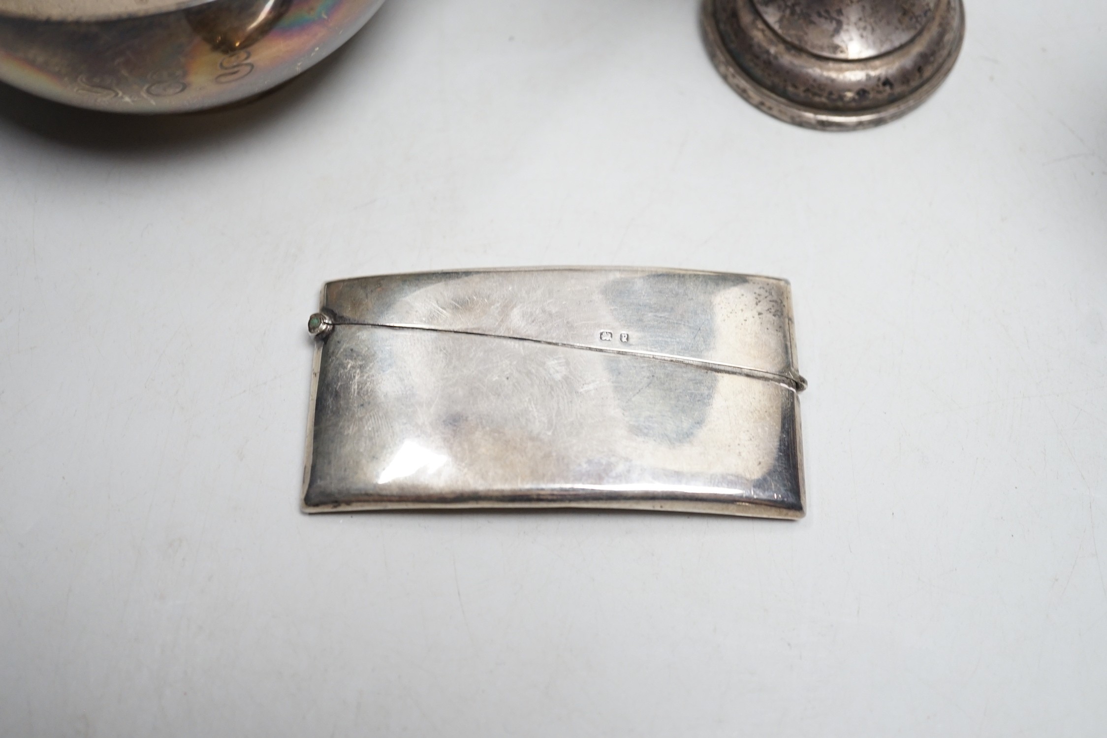 A George V silver two handled bowl, by Sebastian Garrard, London, 1926, 15.5cm, 6.5oz, a silver card case, small silver cup and a Ceylonese white metal posy vase.